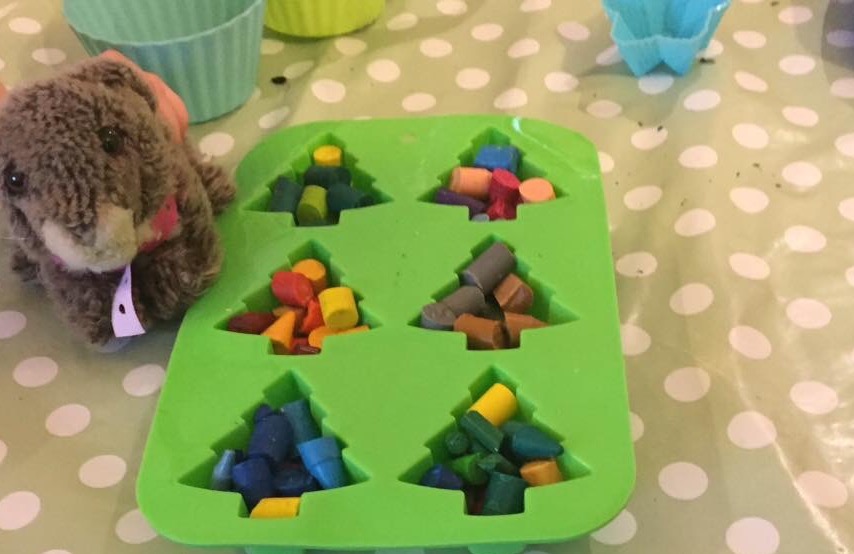 Crayons in silicone moulds before going into the oven
