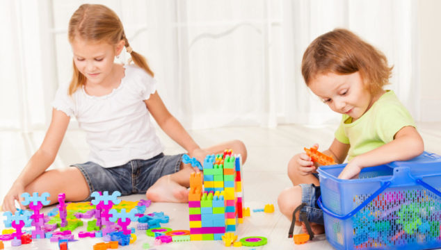 Older children playing with toys