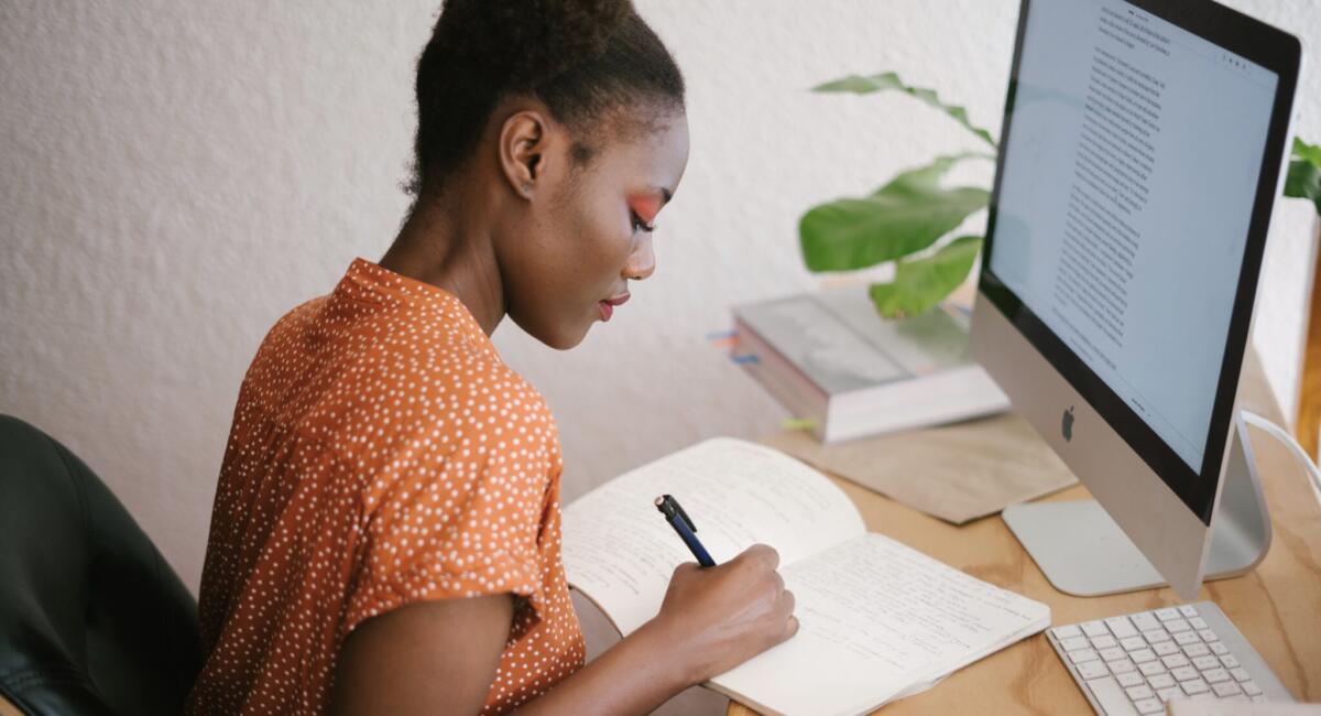 Woman writing at home